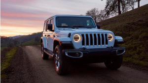 White 2020 Jeep Wrangler on a dirt road